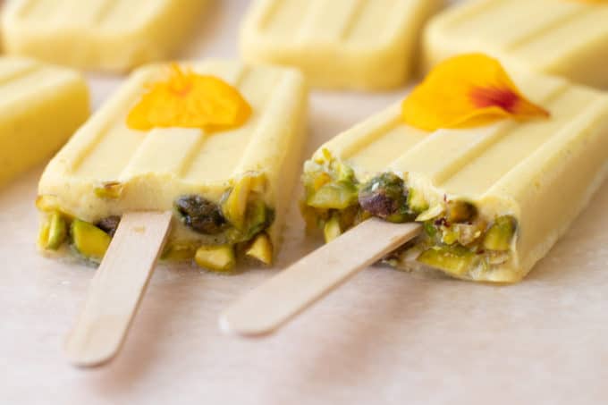 close up of Mango Cardamom Coconut Popsicles.