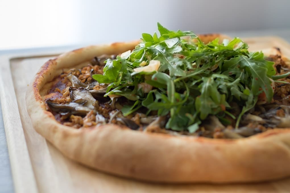 Vegan Korean Barbecue Pizza on a cutting board.