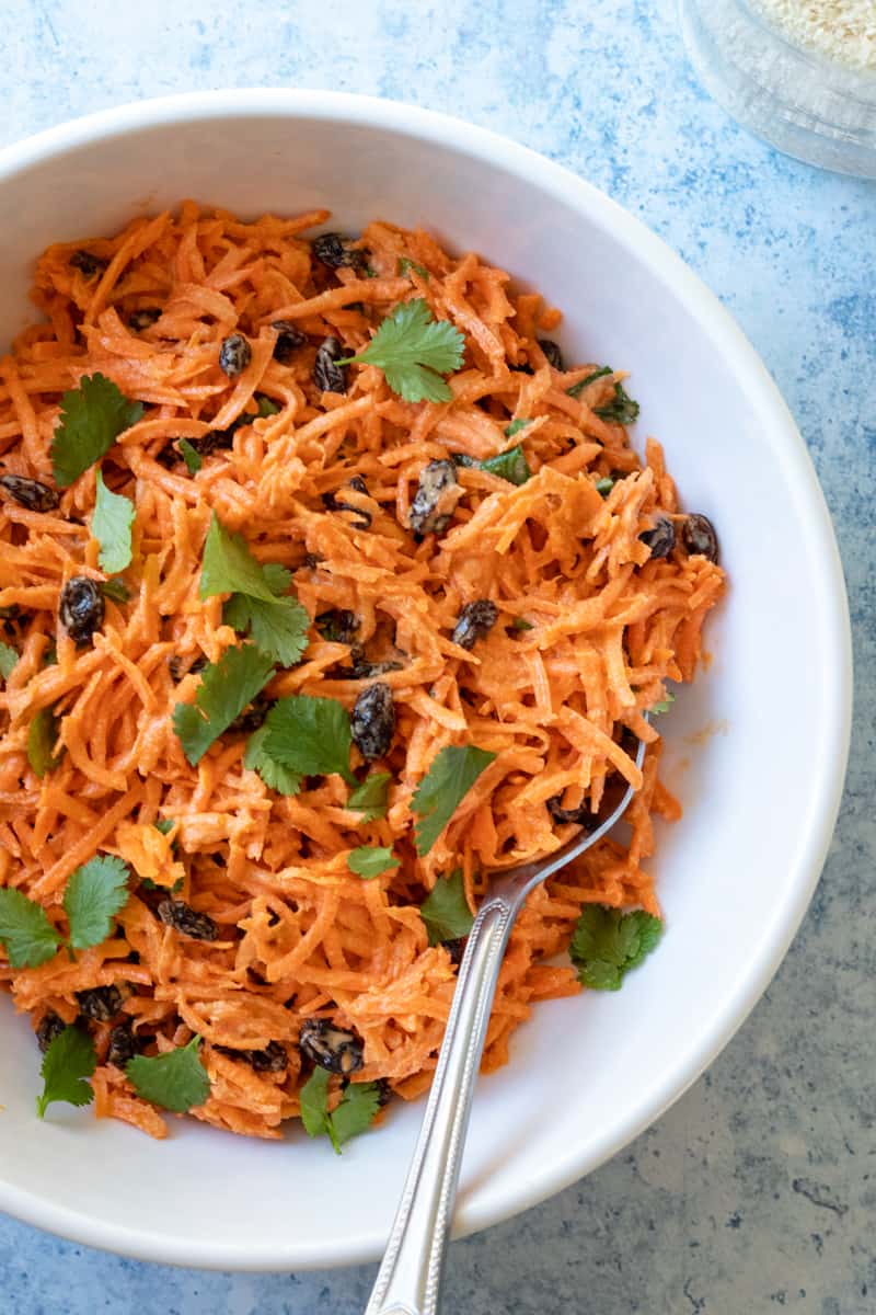 overhead view of carrot salad in a bowl