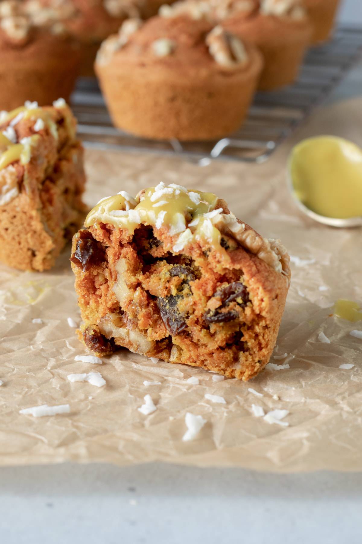 view of the inside of a muffin, with raisins and walnuts.