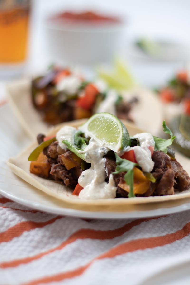 Refried Black Bean and Tempeh Tacos with Creamy Lime Dressing