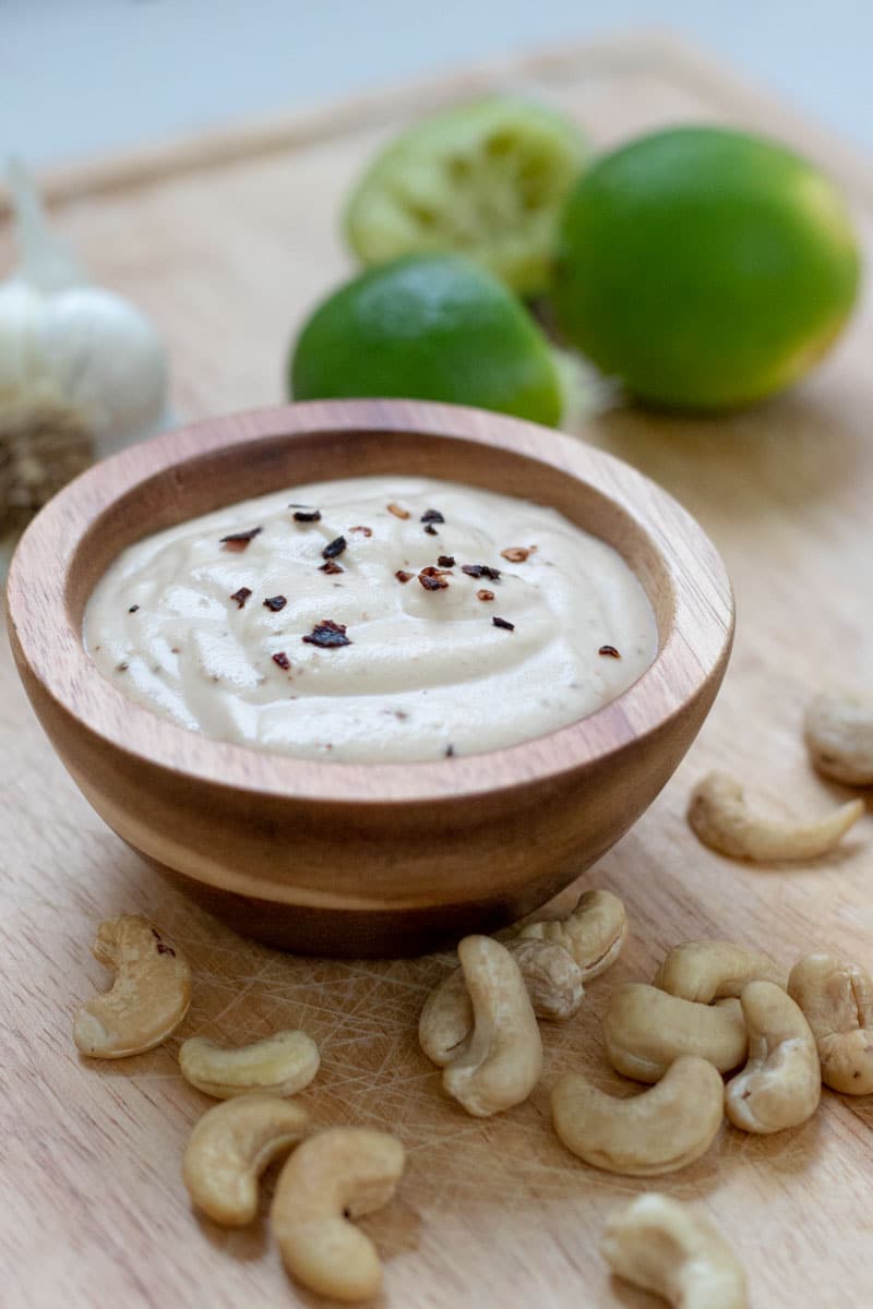 Creamy Chipotle Lime Dressing in a small wood bowl