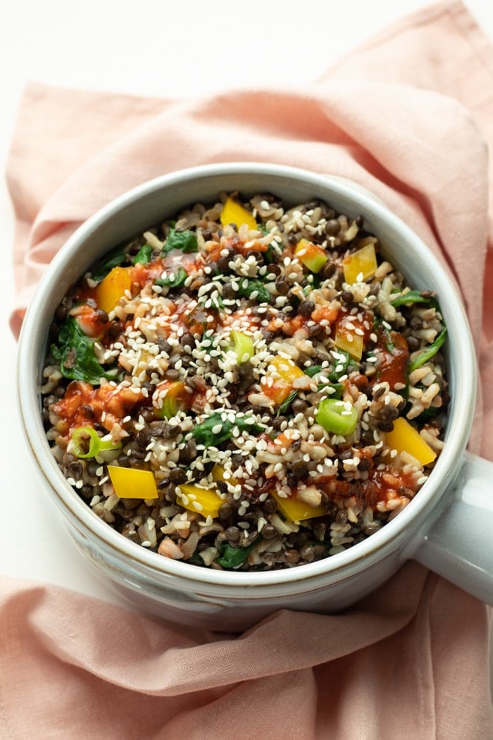 Black Lentil and Rice Bowl topped with yellow pepper and sesame seeds