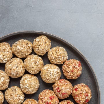 popped sorghum balls on a black plate