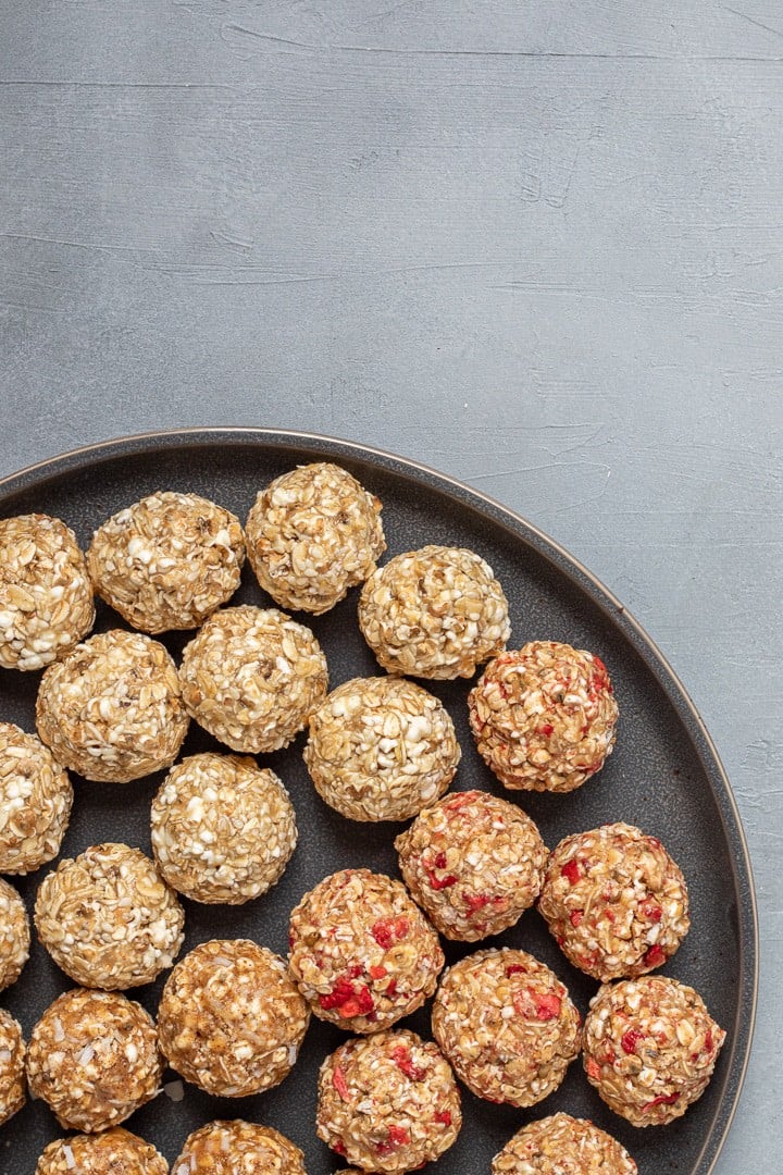 popped sorghum balls on a black plate