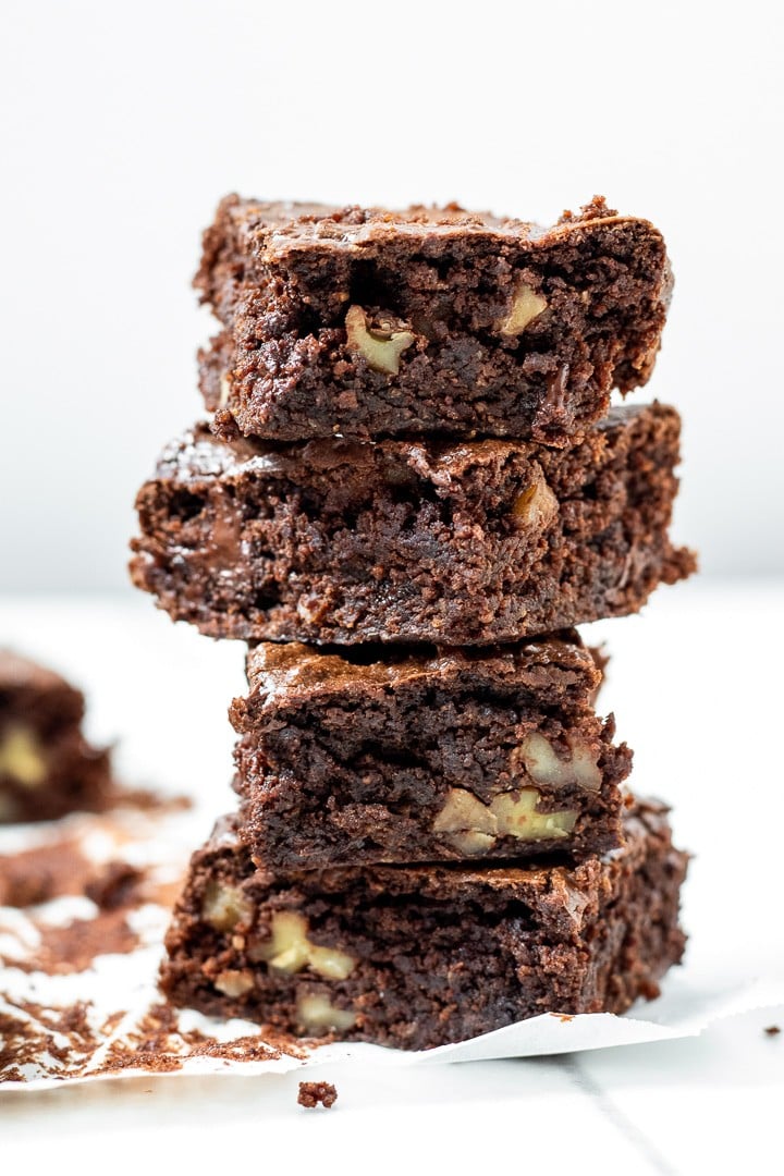a stack of vegan peanut butter brownies against a white background