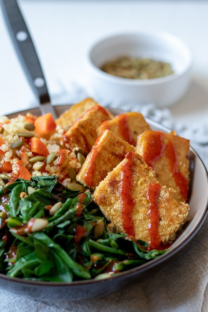 close up of Sweet Mustard Tofu with Millet Pilaf and Greens