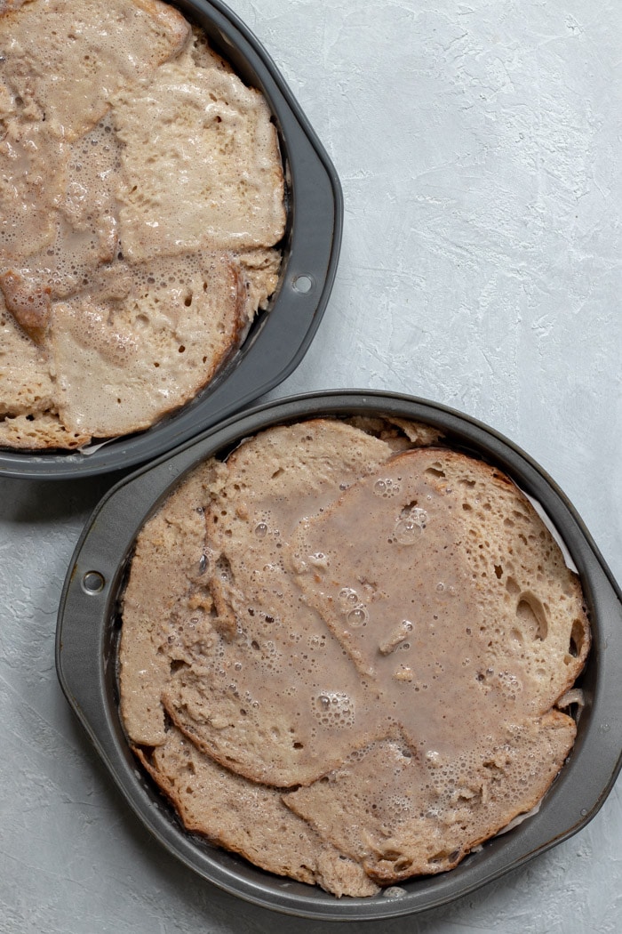 sourdough soaked in vegan french toast batter fit inside cake pans