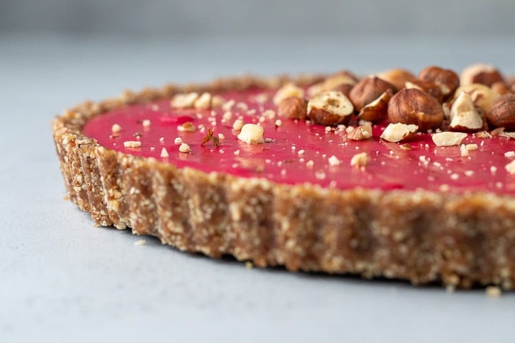 side view of Cranberry and Citrus Tart with Hazelnut Crust