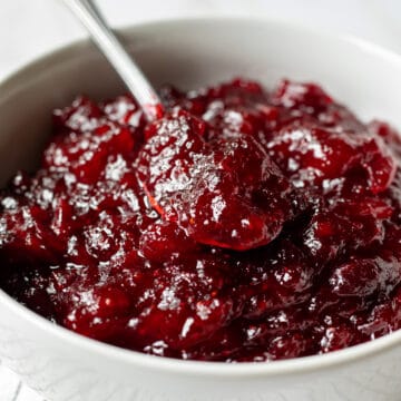 spoon scooping up naturally sweetened cranberry sauce.