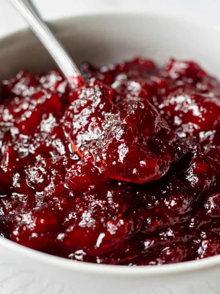 spoon scooping up naturally sweetened cranberry sauce.