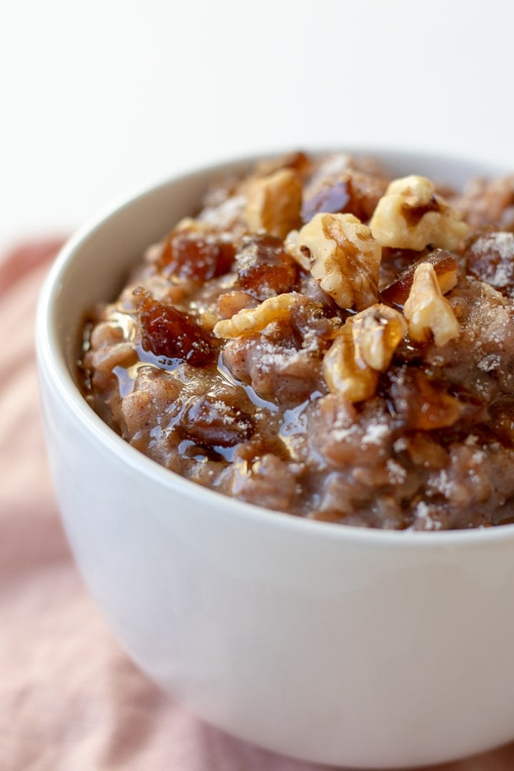 Farro Breakfast Pudding with dates, drizzled with maple syrup