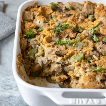 closeup of vegan cornbread dressing with a slice cut