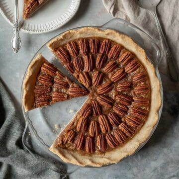 overhead view of bourbon pie with two slices cut.