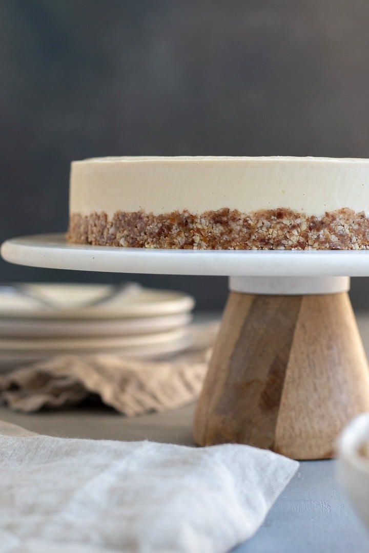 straight on view of cheesecake on a cake stand.