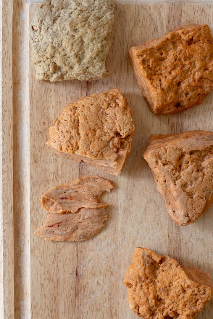 Vegan jerky dough on a cutting board being sliced