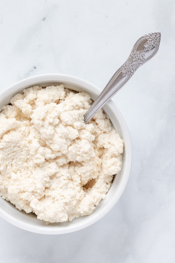 fluffy vegan ricotta in a ramekin.