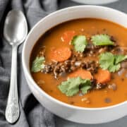 Curry Black Lentil Soup garnished with cilantro.
