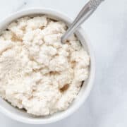 close up overhead view of almond ricotta in a small bowl.