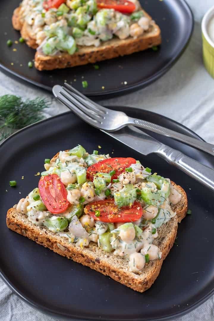 Chickpea Salad With Dill, open face sandwiches on black plates