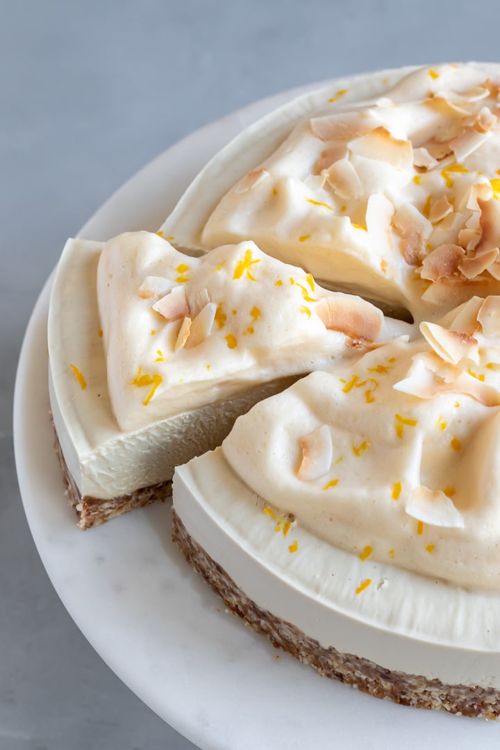 sliced cheesecake topped with whipped aquafaba.