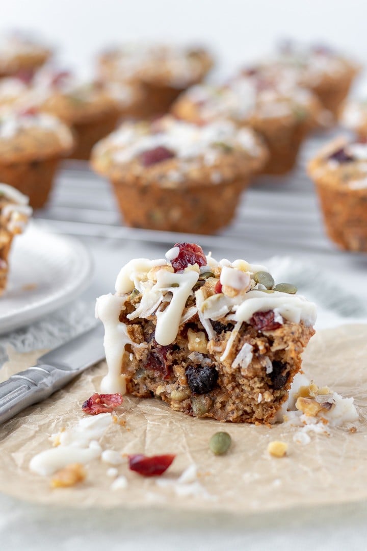 Muffin cut in half showing plump raisins inside.