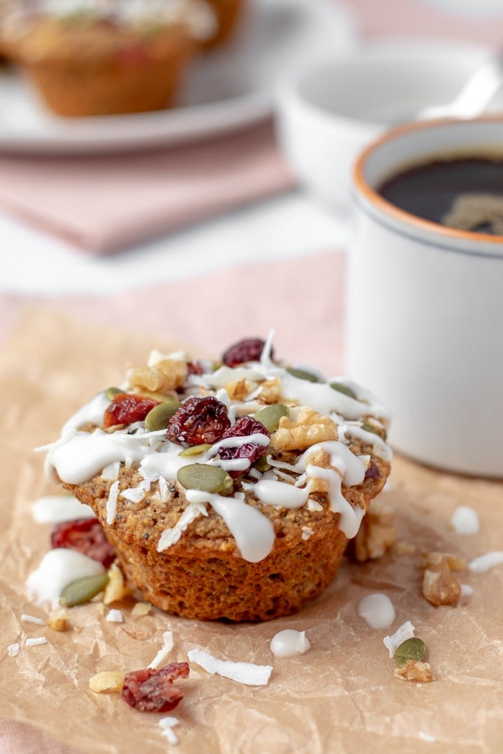 close up showing dried fruit and other toppings on oat flour muffin.