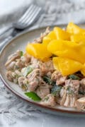 Deceptively light and nutritious, this vegan jackfruit salad is made with fresh dill, mango, lemon zest and roasted poblano pepper. Perfect as an appetizer, side dish, or add plant-based protein + whole grains for a satisfying meal. #jackfruit #vegan #oilfreemayo #mango #appetizer #partyfood