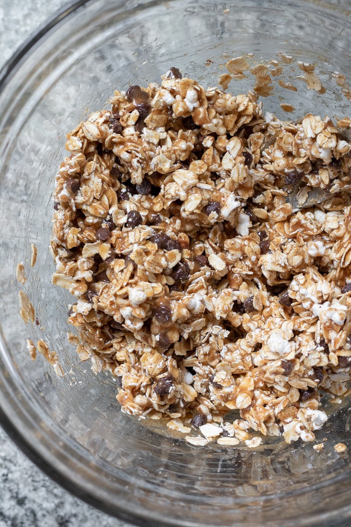 Oats, popped sorghum, and chocolate chips coated in brown rice syrup and almond butter mixture.