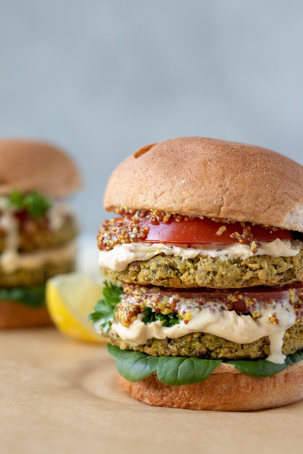 colorful chickpea burgers stacked on a bun.