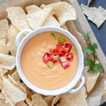 overhead photo of vegan cashew queso in a white dish.