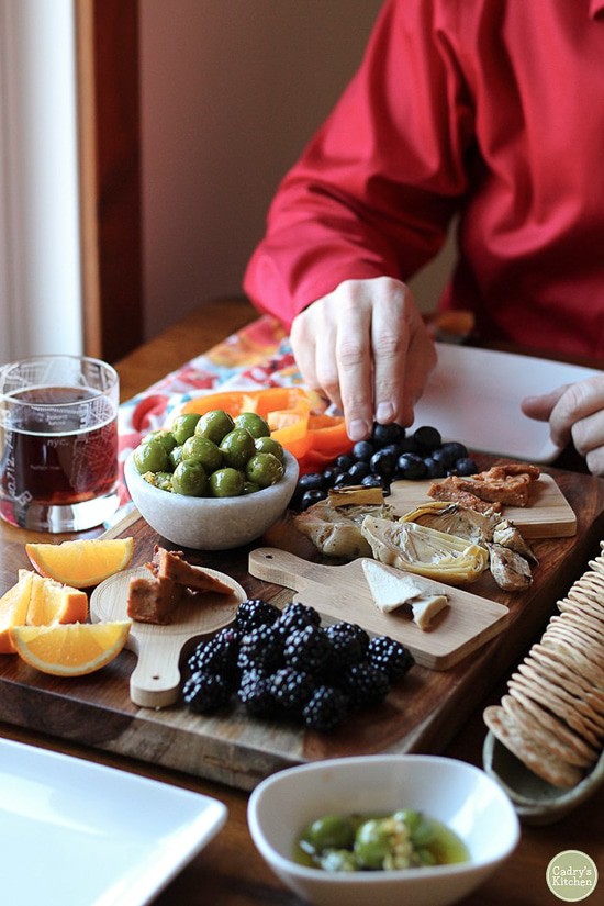 vegan snack platter featuring marinated castelvetrano olives