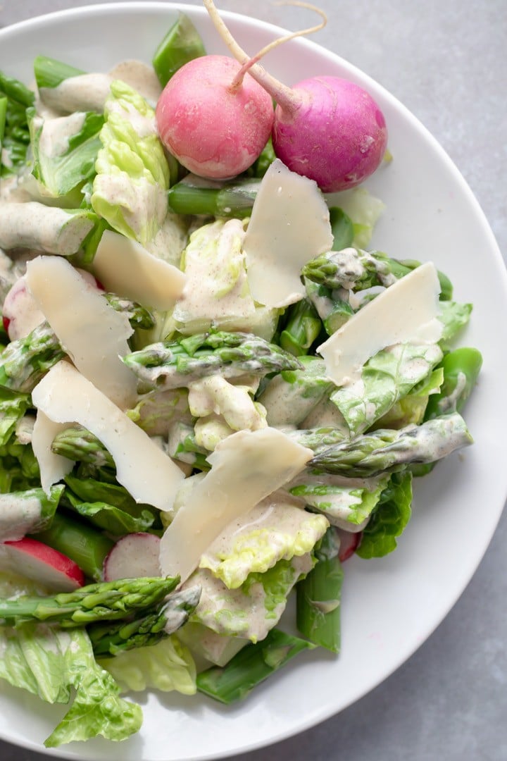 Asparagus Salad with Lemon-Chia Dressing topped with Violife vegan parmesan.