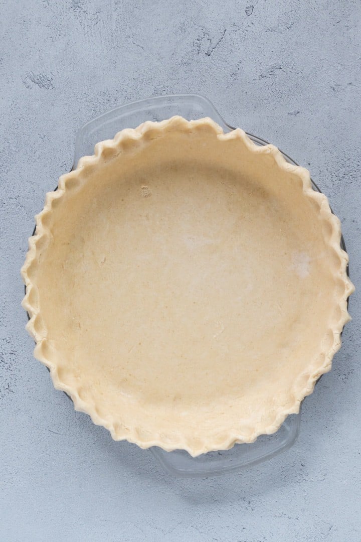 unbaked pie crust in a pie plate.