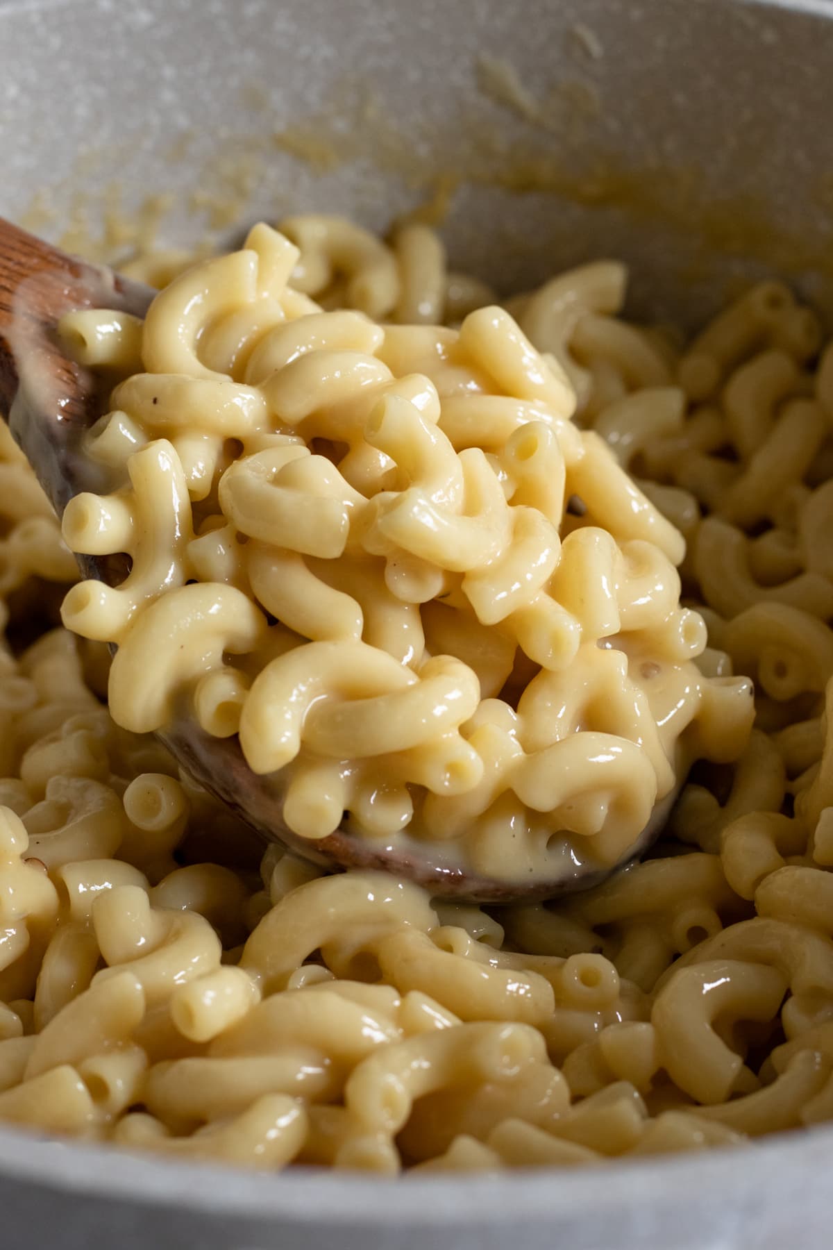 close up showing the creamy non-dairy sauce on macaroni elbows.