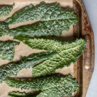 kale leaves on a baking sheet