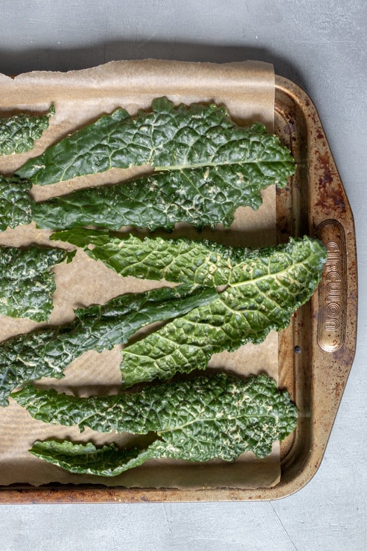 kale leaves on a baking sheet.