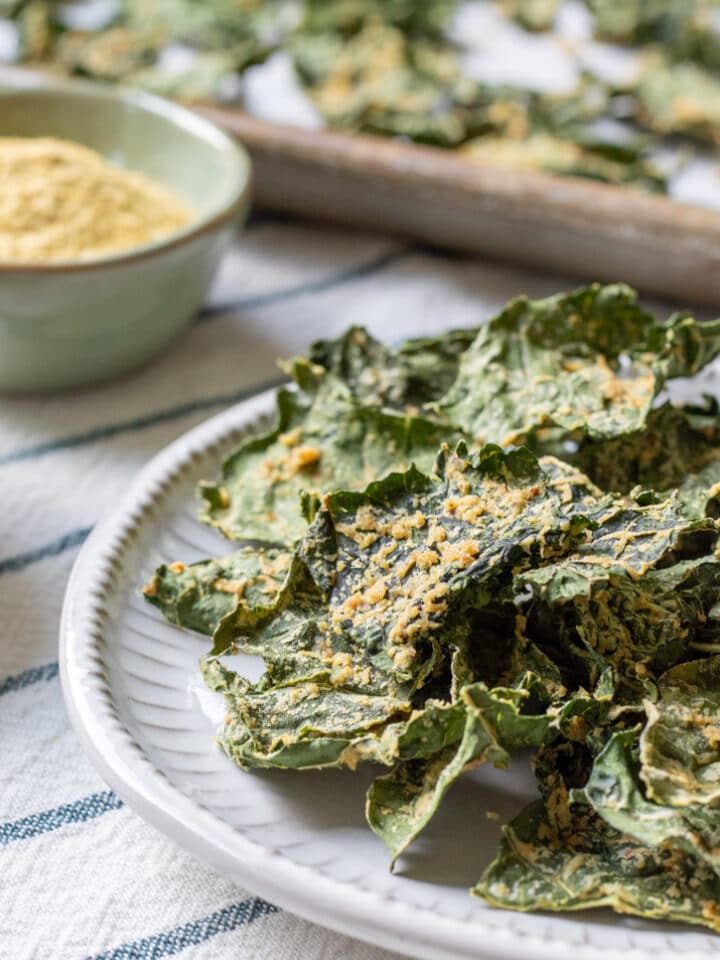 oil-free kale chips stacked on a plate