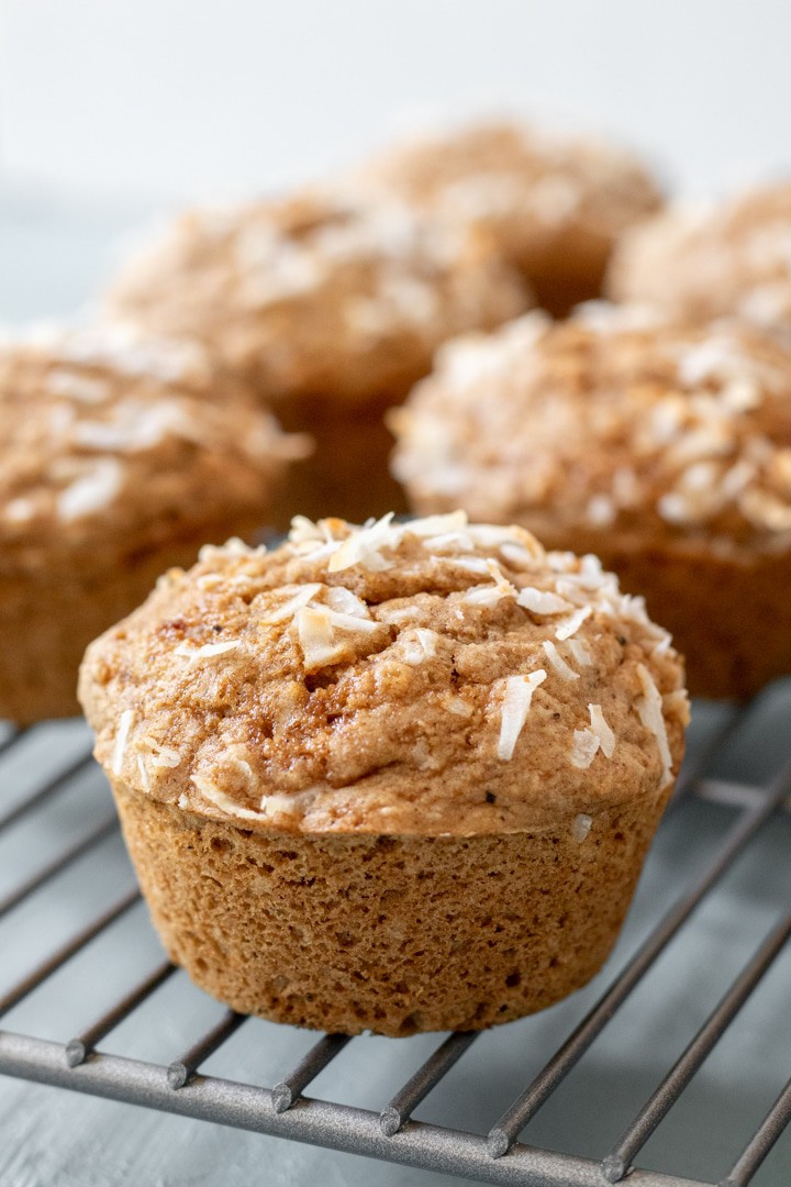 close up of muffin on cooling rack.