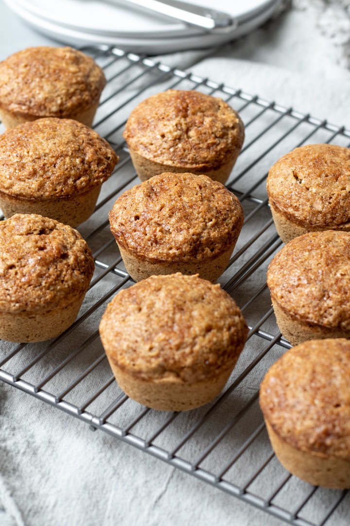 coconut milk muffins on a cooking rack.