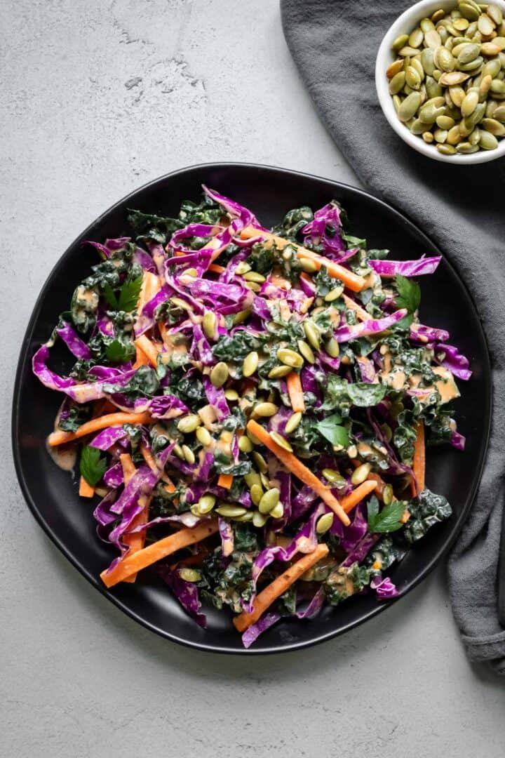 overhead shot of kale slaw on plates.