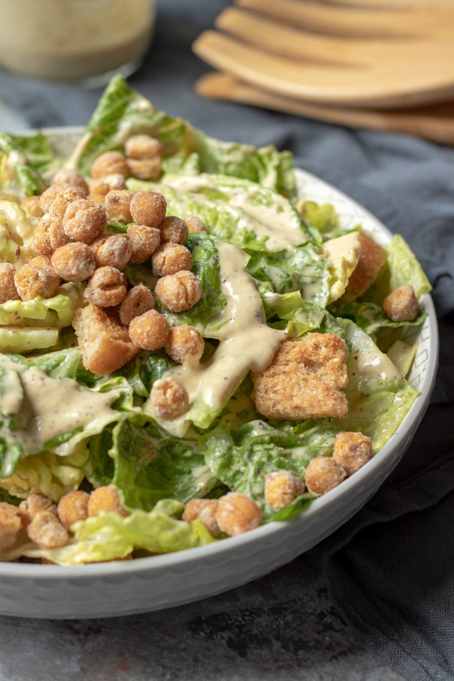 Vegan Caesar topped with Roasted Chickpeas and creamy dressing.