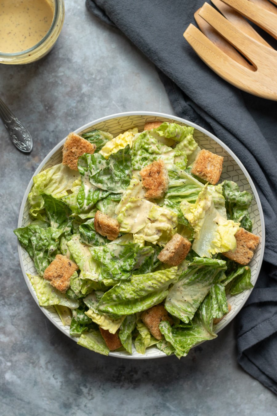 Vegan Caesar Salad with crisp romaine and seasoned croutons.