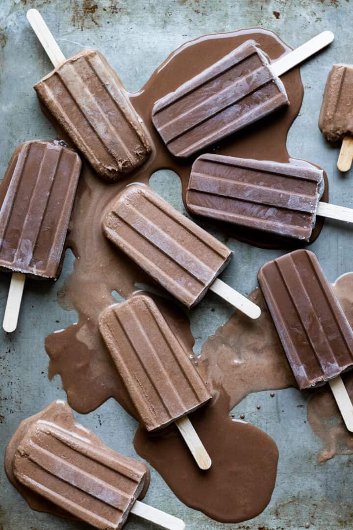 Kahlua Fudgesicles melting on an old baking sheet.