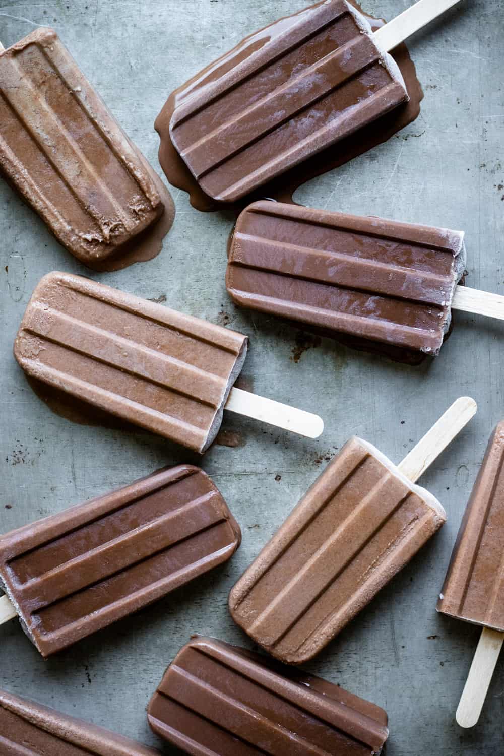 vegan fudgesicles on an old baking sheet.