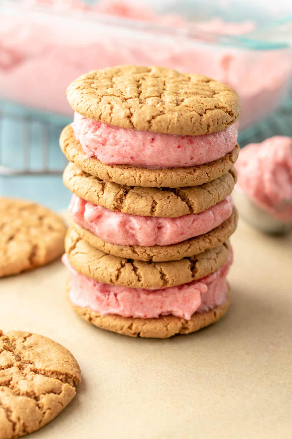 a stack of vegan cookie sandwiches filled with healthy frozen banana ice cream.