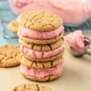 a stack of vegan ice cream sandwiches made with pink strawberry ice cream.