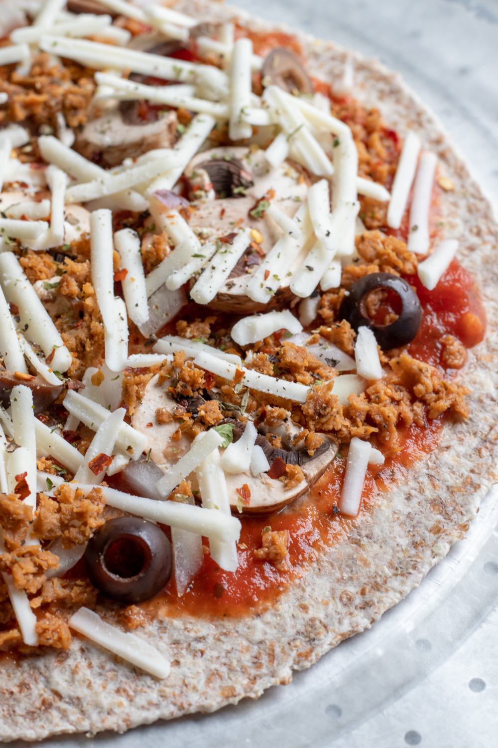 easy vegan pizza prepped, ready to be baked or frozen for later