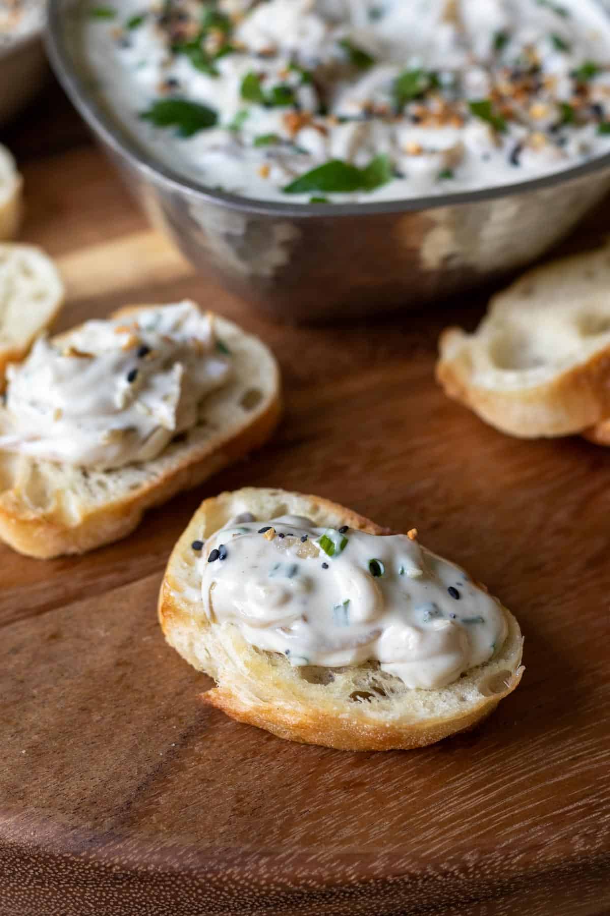 creamy onion dip on toasted baguette.