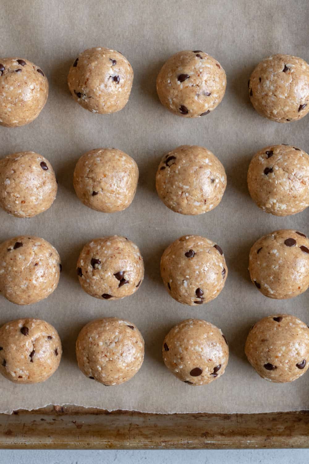 homemade coconut-almond energy balls on parchment paper.
